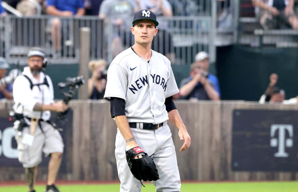 Andrew Heaney in New York Yankees uniform focused on field ready for action during baseball game Wallpaper