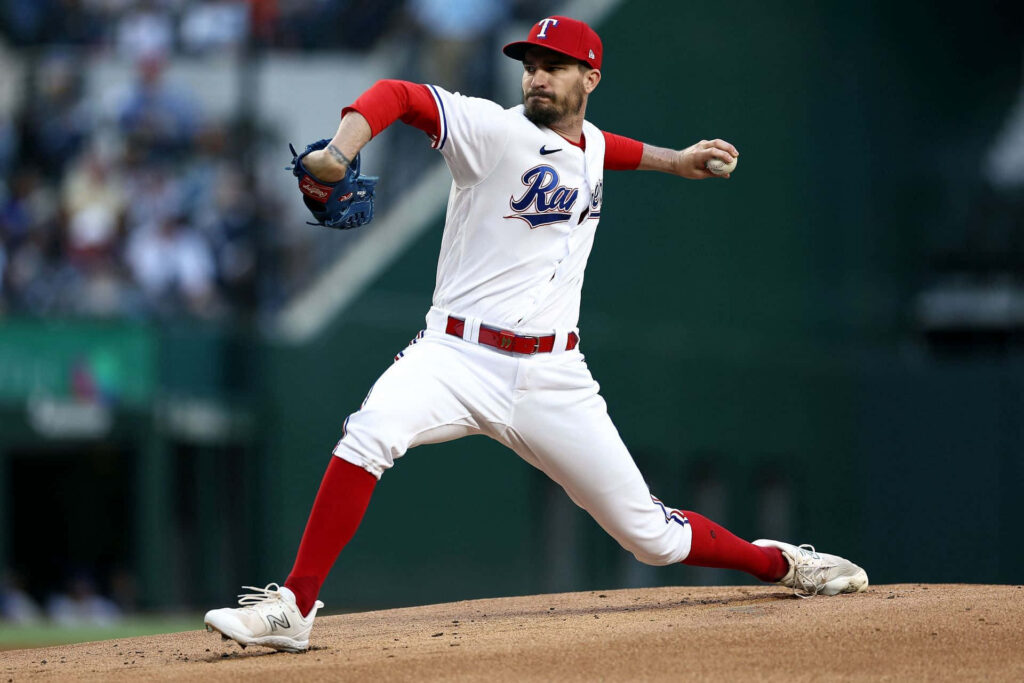 Andrew Heaney pitching for Texas Rangers with intense focus professional baseball action wallpaper