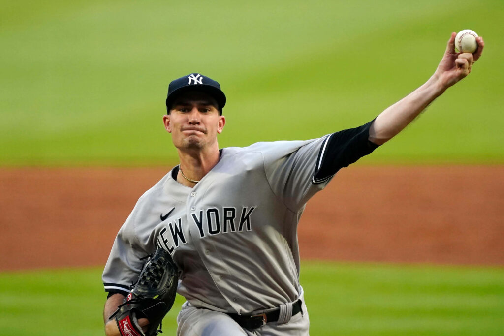 Andrew Heaney pitching in New York Yankees uniform showing focus and athletic form on mound Wallpaper