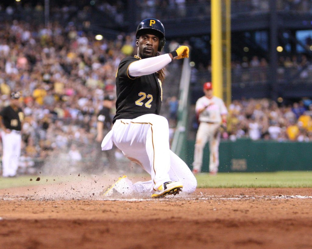 Andrew McCutchen Pittsburgh Pirates kneeling kicking dirt bright stadium lights baseball action Wallpaper