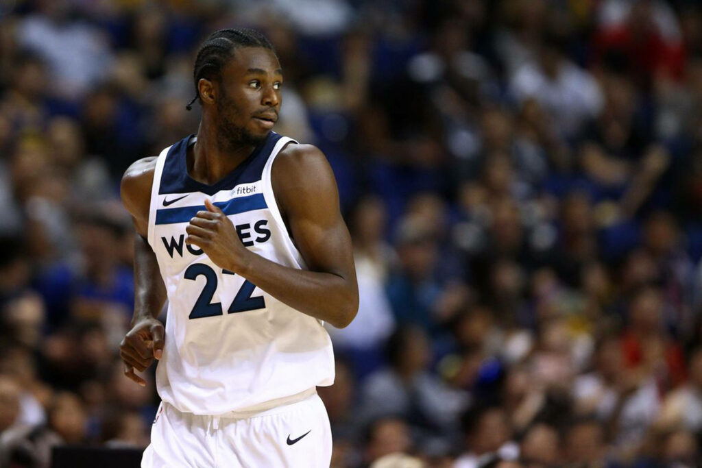 Andrew Wiggins in Minnesota Timberwolves jersey focused during intense basketball game action Wallpaper