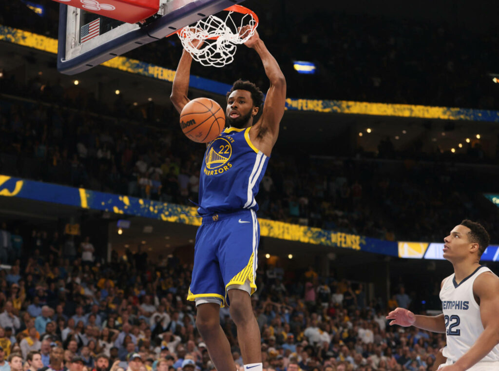 Andrew Wiggins powerful dunk basketball wallpaper showcasing intense athleticism and energy