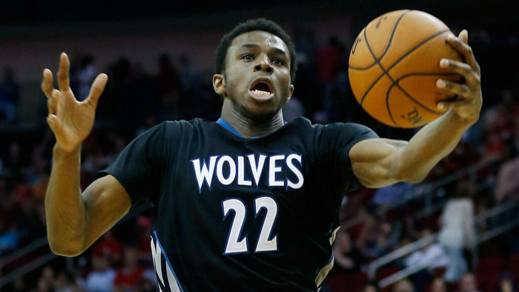 Andrew Wiggins Timberwolves catching shot with intense focus on basketball court wallpaper