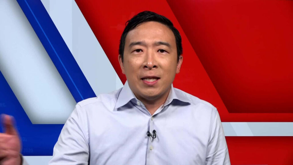Andrew Yang confident against red blue geometric background Asian American political leader wallpaper
