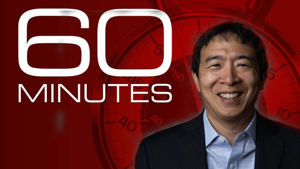Andrew Yang smiling with 60 Minutes logo on bold red background TV news wallpaper background