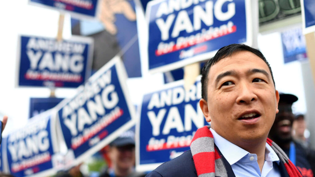 Andrew Yang supporters rally with signs Andrew Yang for President vibrant public event wallpaper