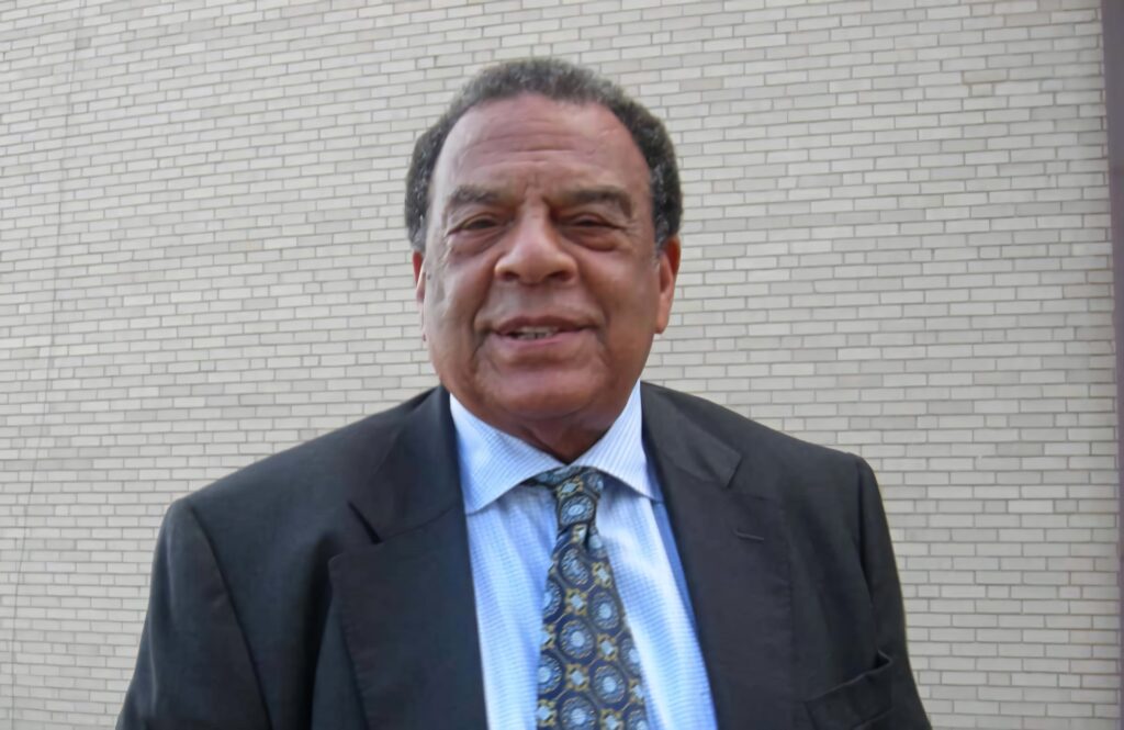 Andrew Young portrait in formal suit symbolizing visionary leadership and influential legacy wallpaper