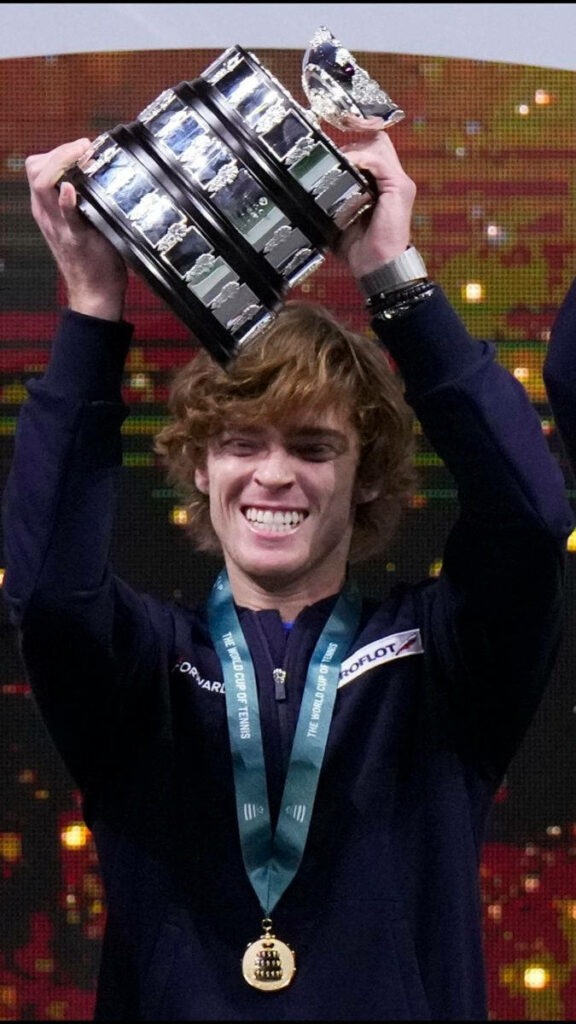 Andrey Rublev celebrating tennis victory holding trophy joyful dynamic sports wallpaper background