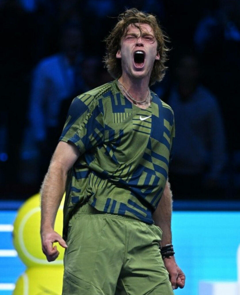 Andrey Rublev shouting on tennis court showing intense determination in high-stakes match wallpaper