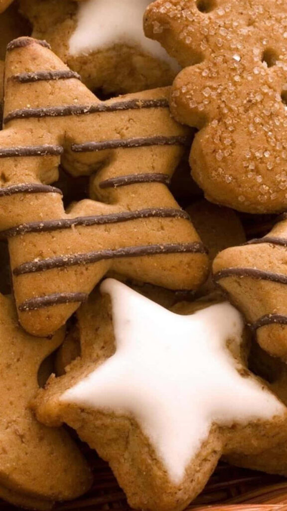 Dessert Galore: A Sweet Array of Star-shaped Cookies on Delights Wallpaper