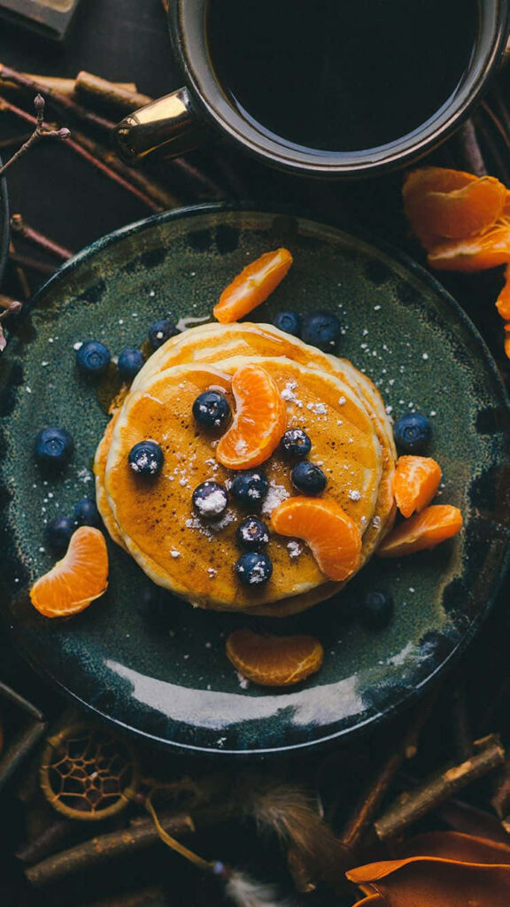 Deliciously Vibrant: Fresh Fruity Pancake Delight on Desserts Backdrop Wallpaper