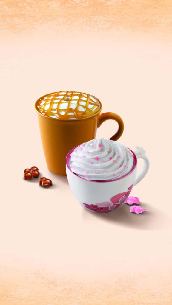 Delicious Duo: Caramel Macchiato and Refreshing Peach Tea Latte in Scrumptious Dessert Setting Wallpaper