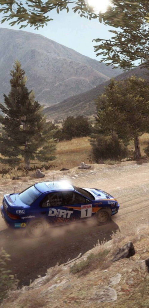 Dirt Rally wallpaper: Blue rally car with '1' speeding on gravel track against scenic backdrop