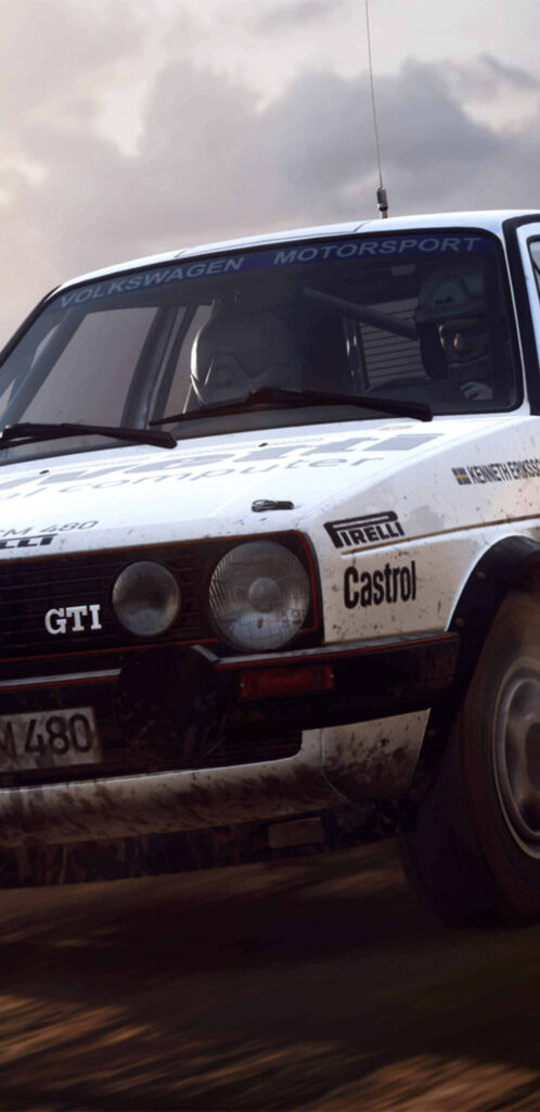 Vintage Volkswagen Motorsport Car Speeding Through Off-Road Rally Race Wallpaper