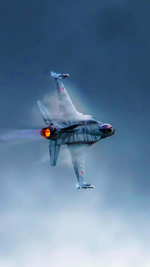 F-16 Fighting Falcon: Sky-High Maneuvers in Misty Blue Skies Wallpaper