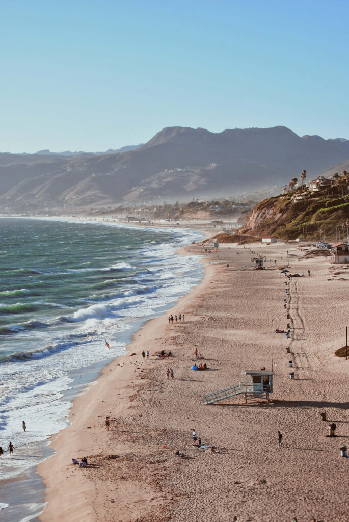 Paradise Found: Malibu Backdrop Showcasing Point Dume Beach Bliss Wallpaper