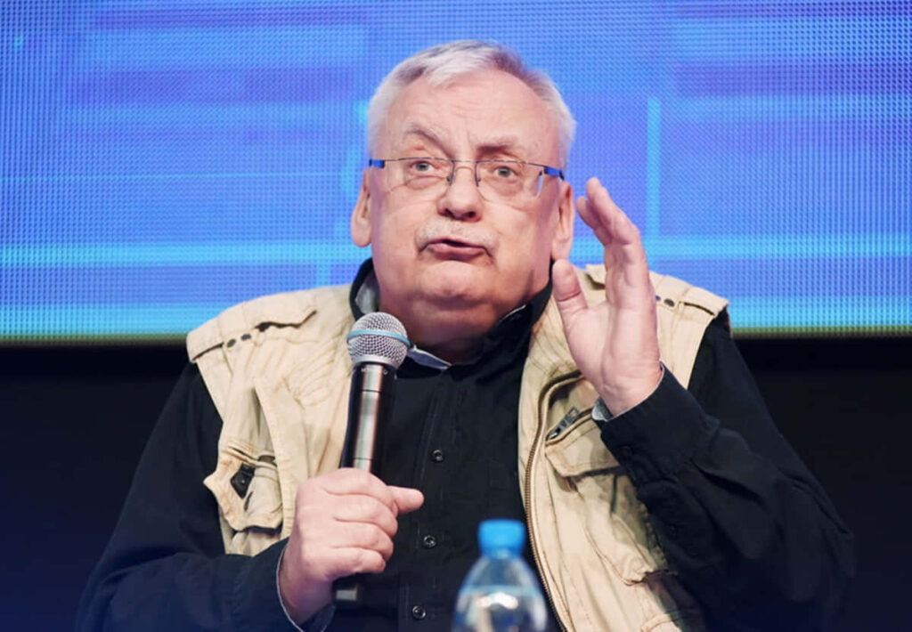 Andrzej Sapkowski speaking at book signing event perfect wallpaper for fans of author