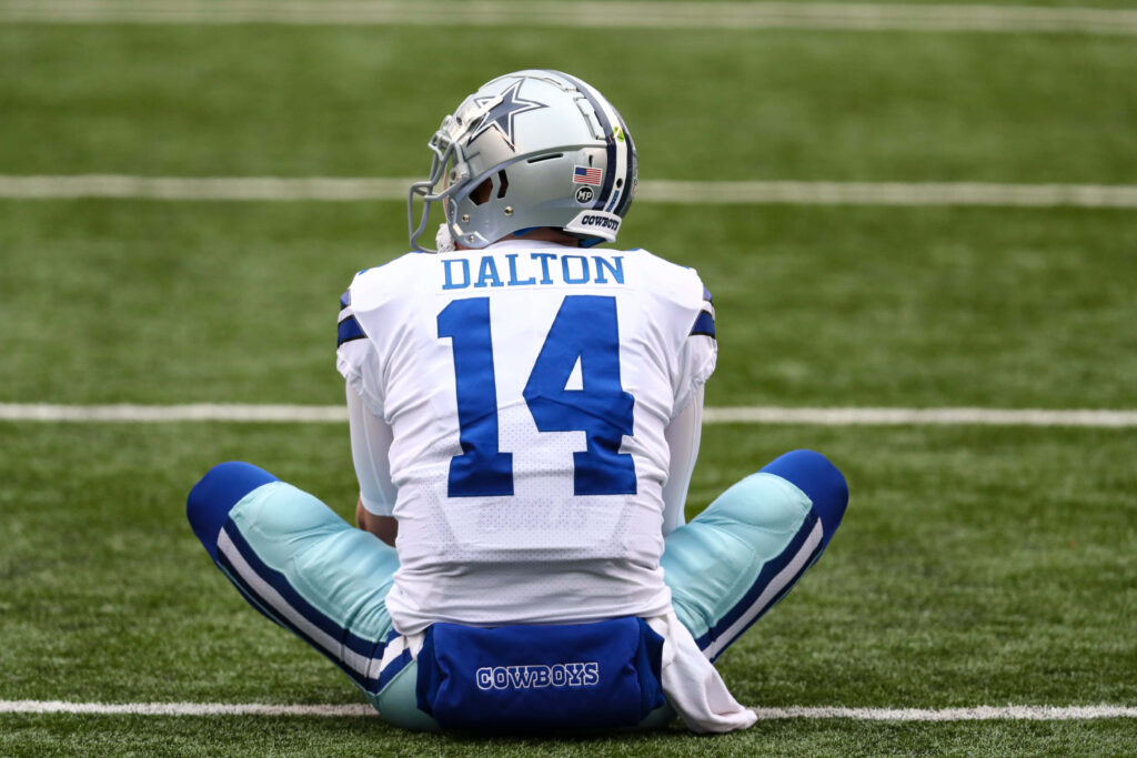 Andy Dalton Dallas Cowboys quarterback seated on field in uniform reflecting during game wallpaper