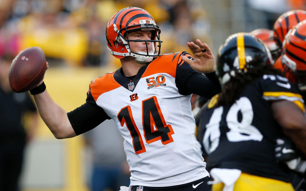 Andy Dalton poised to throw NFL pass intense quarterback action wallpaper background