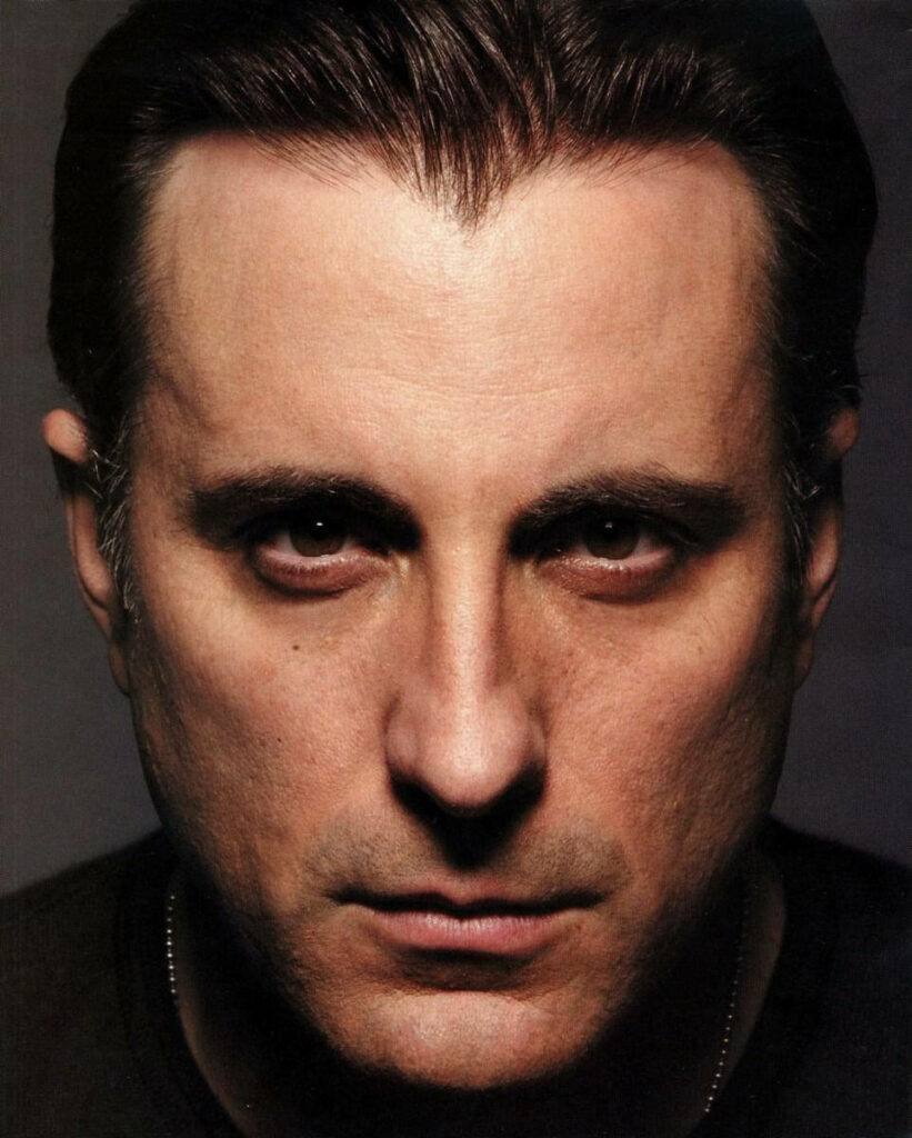 Close-up portrait of Andy Garcia with intense gaze and detailed expressive features wallpaper background