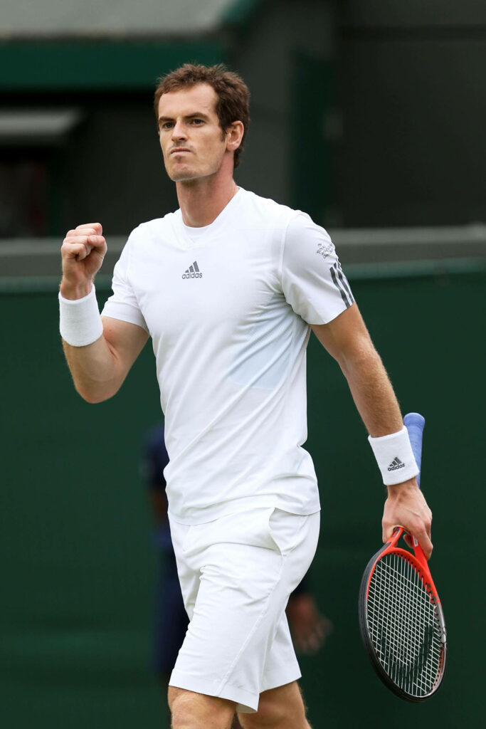 Andy Murray playing tennis in Adidas sportswear focused and determined on court wallpaper background