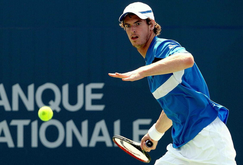 Andy Murray focused during National Bank Open tennis match ready to return a shot on court Wallpaper