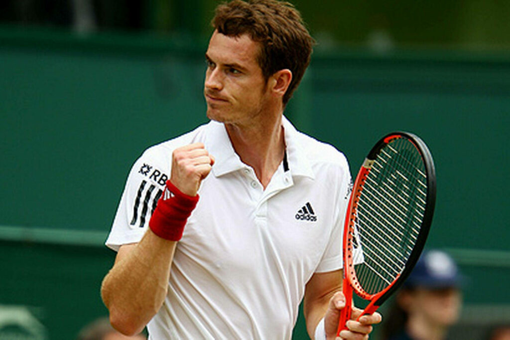 Andy Murray clenches fist in dynamic tennis celebration wallpaper showing intense determination