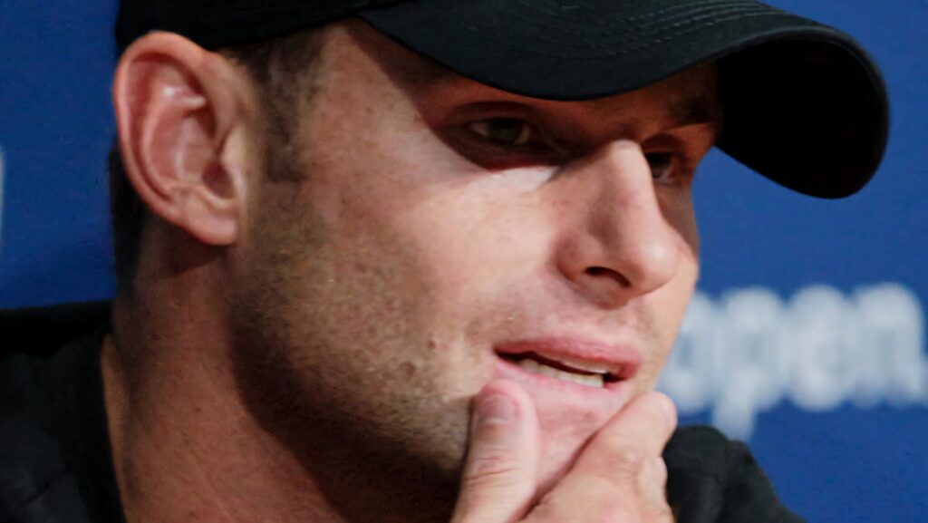 Andy Roddick close-up portrait thoughtful expression reflecting focus tennis player wallpaper