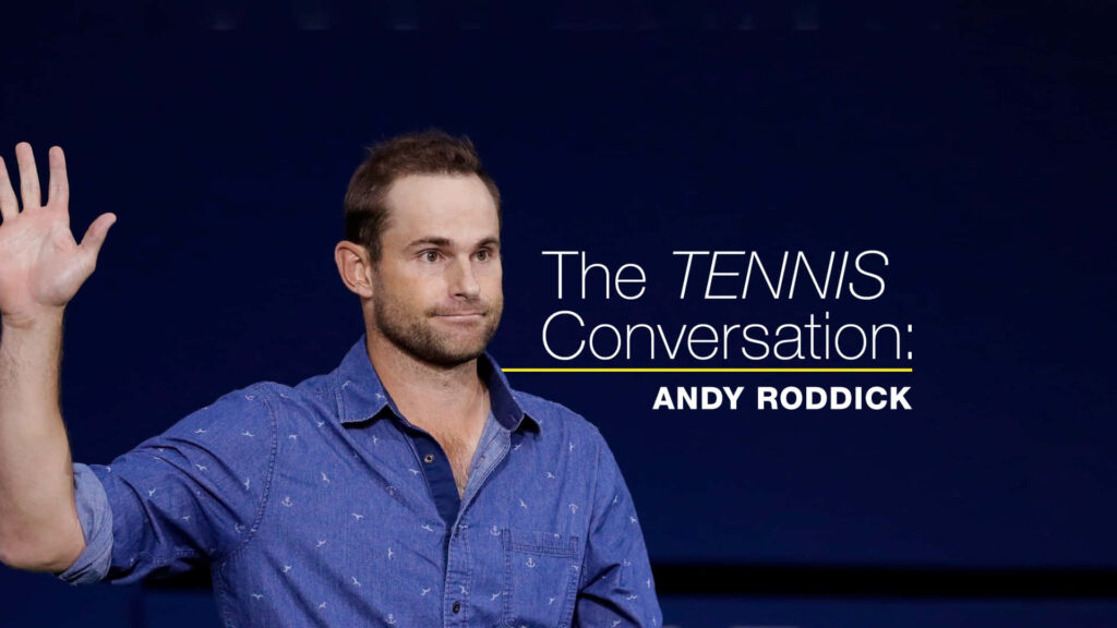 Grand Slam Champion Andy Roddick in denim shirt raising hand during interview on blue background Wallpaper