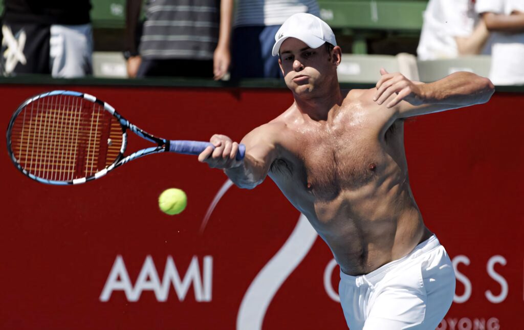 Andy Roddick shirtless on tennis court showcasing athletic physique and intense match focus wallpaper