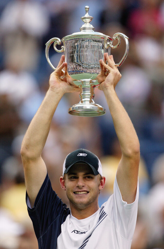 Andy Roddick celebrating 2003 US Open victory holding trophy perfect tennis wallpaper background