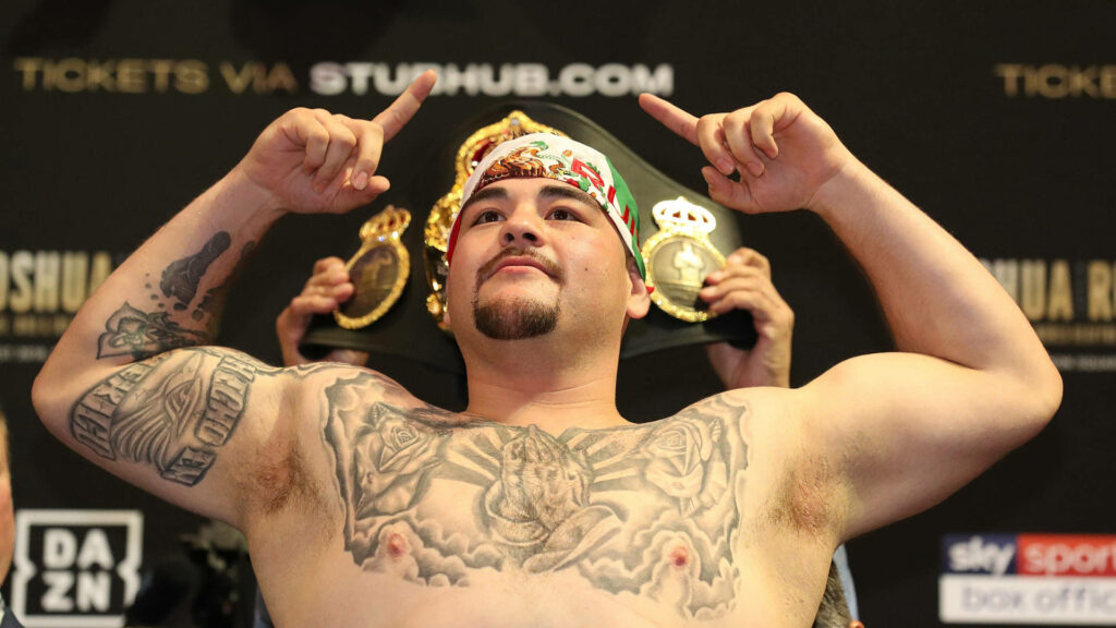 Andy Ruiz Jr holding championship belt at weigh-in showing confidence determination pride Wallpaper