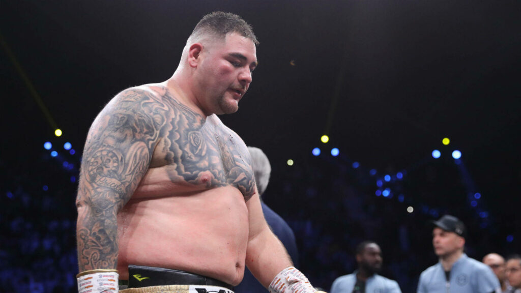 Andy Ruiz Jr focused in boxing ring surrounded by vibrant arena energy wallpaper background