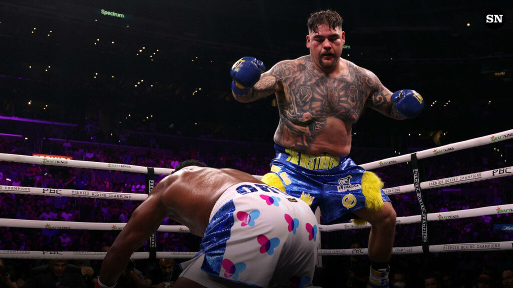 Andy Ruiz Jr. lands a powerful knockdown punch on Anthony Joshua in heavyweight title fight wallpaper background