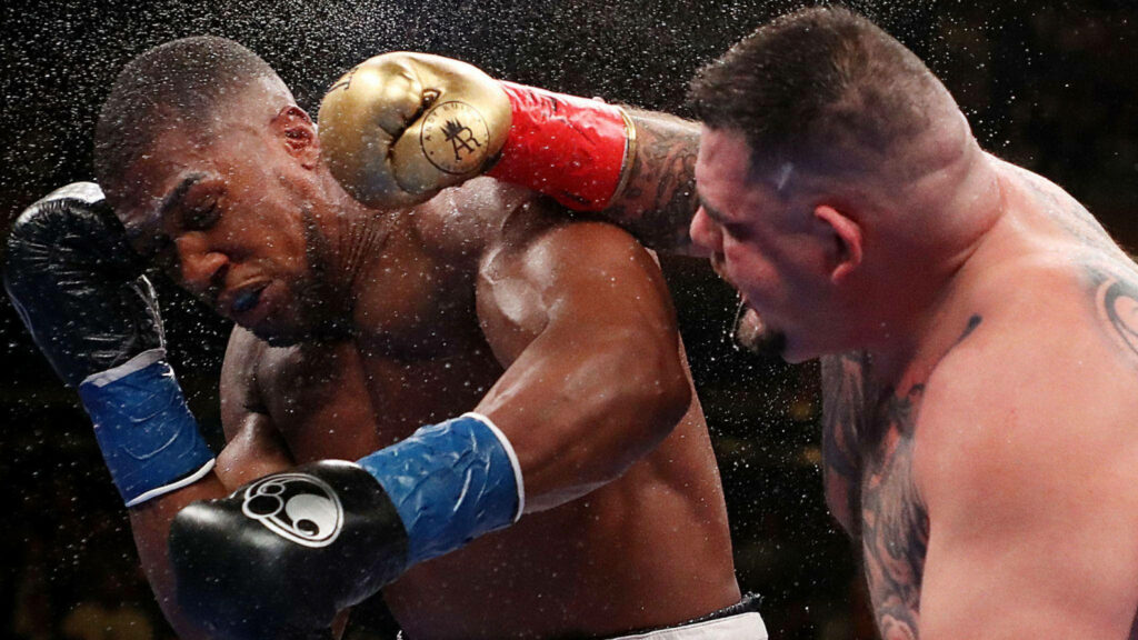 Andy Ruiz Jr. delivers powerful punch to Anthony Joshua in intense boxing match action wallpaper