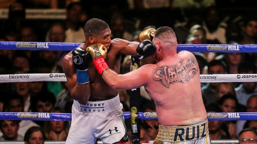 Andy Ruiz Jr and Anthony Joshua intense boxing match face off high energy ring wallpaper background
