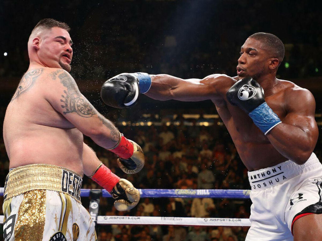 Andy Ruiz Jr and Anthony Joshua intense boxing faceoff legendary match wallpaper background