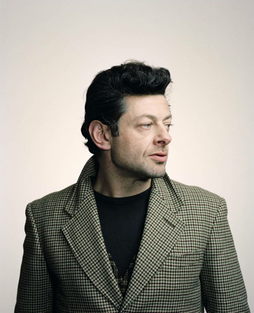 Andy Serkis classic portrait sideways houndstooth jacket light wallpaper background