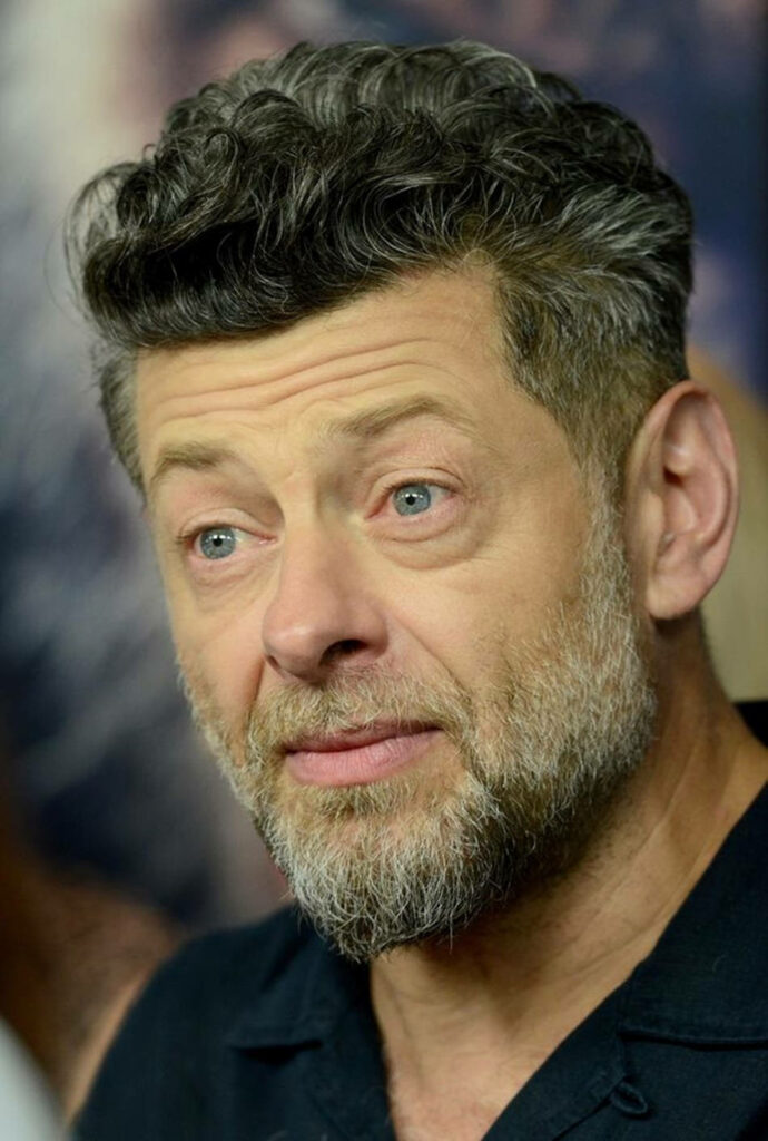 Portrait of Andy Serkis with salt and pepper beard displaying thoughtful expression wallpaper