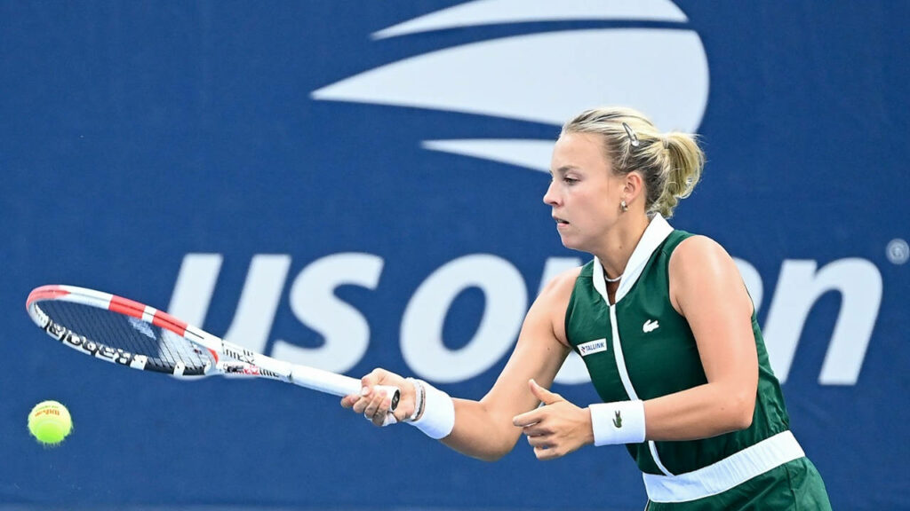 Anett Kontaveit powerful tennis shot US Open match bold blue background wallpaper image
