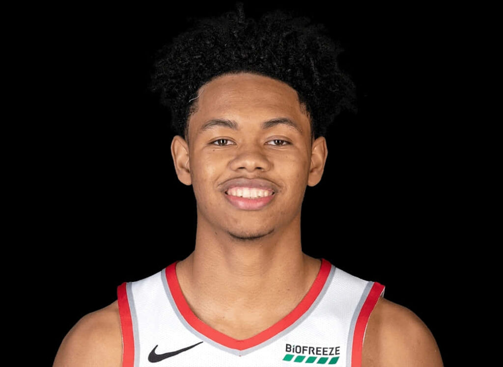 Anfernee Simons basketball portrait smiling in jersey on black background wallpaper design