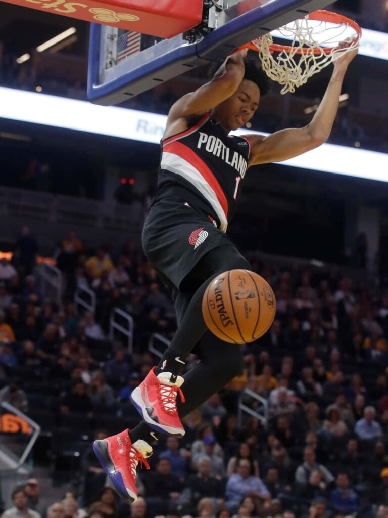 Anfernee Simons Portland Trail Blazers soaring for a powerful dunk NBA action wallpaper background