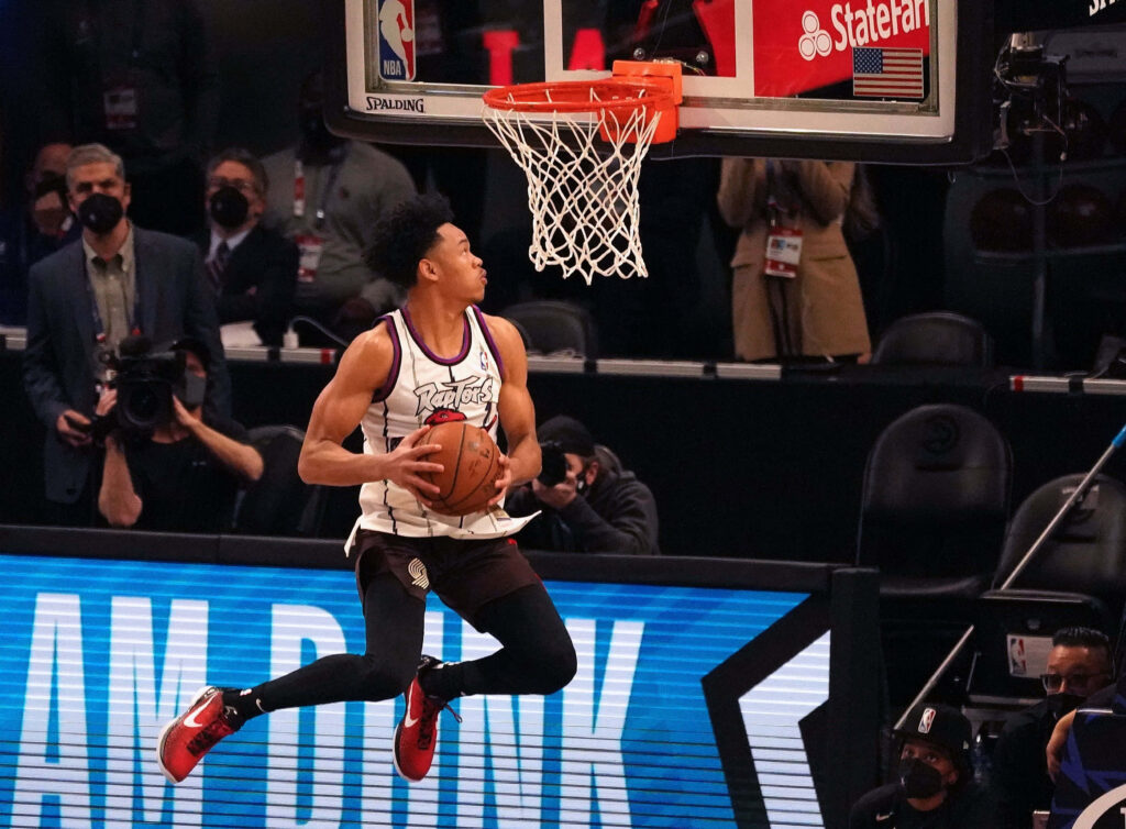 Anfernee Simons mid-air slam dunk NBA Slam Dunk Contest dynamic basketball wallpaper background