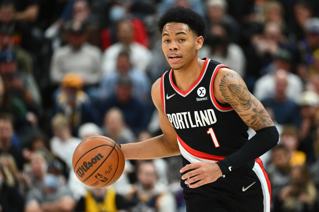 Anfernee Simons dribbling basketball in Portland Trail Blazers uniform dynamic action wallpaper