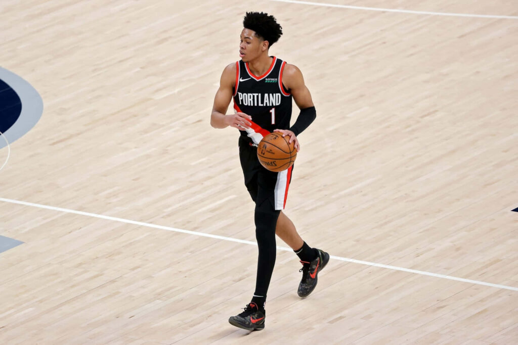 Anfernee Simons dribbling basketball focused on court Portland Trail Blazers dynamic wallpaper