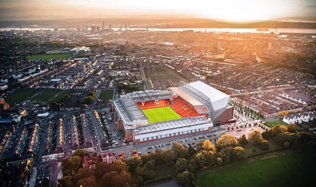 Aerial sunset view of Anfield Stadium Liverpool FC with vibrant city skyline golden light Wallpaper