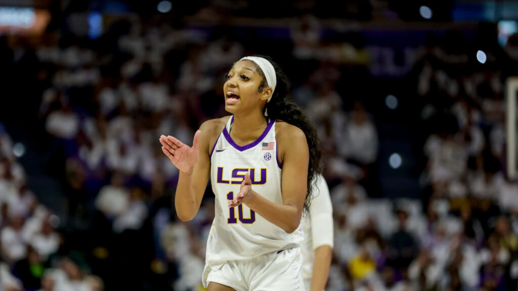 Angel Reese driving the LSU Women’s Basketball game with intensity and leadership action shot Wallpaper