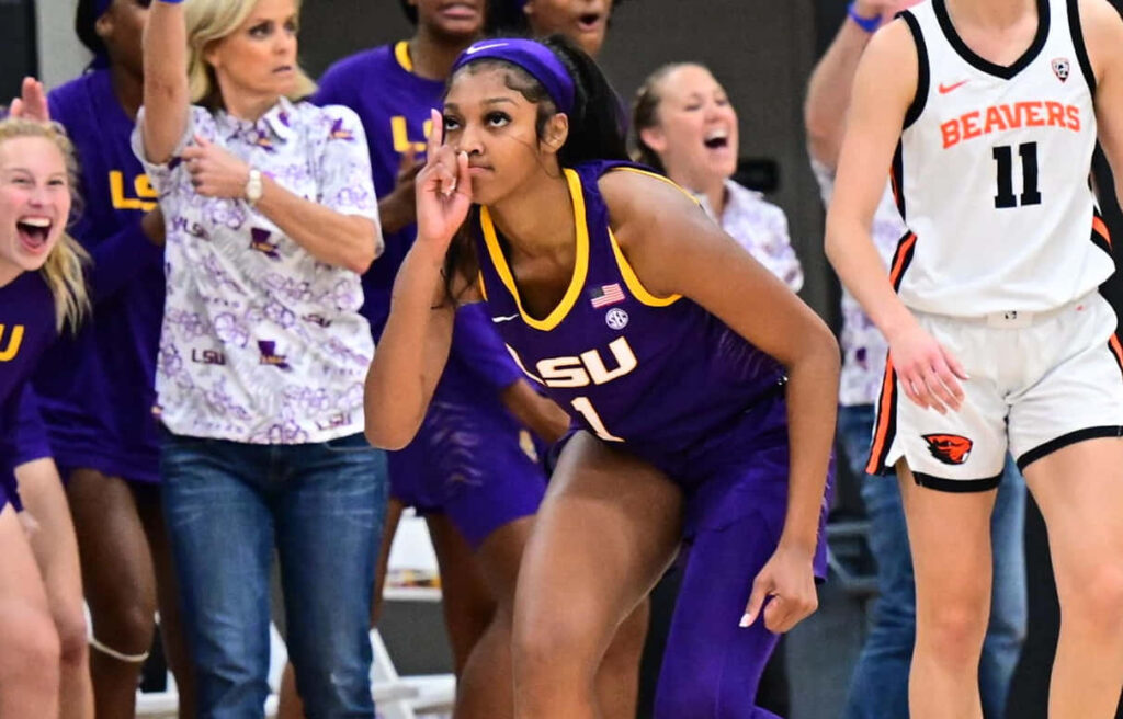Angel Reese LSU basketball player celebrating passionately on court dynamic sports wallpaper background