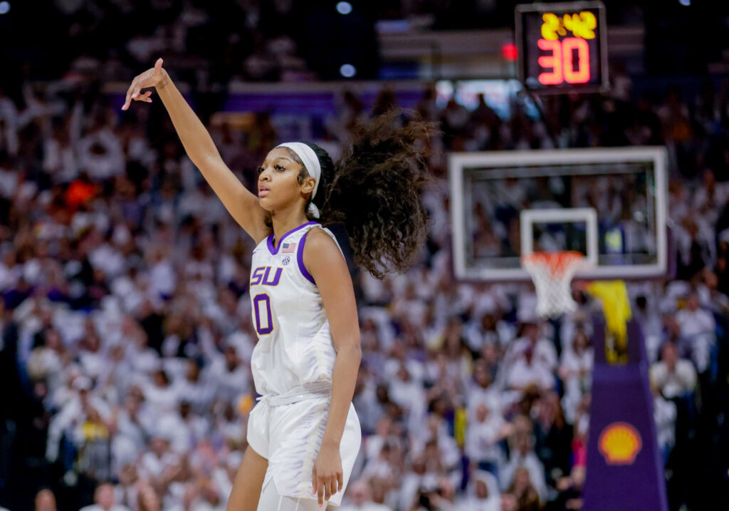 Angel Reese LSU basketball player celebrating energetically on court vibrant competitive spirit wallpaper