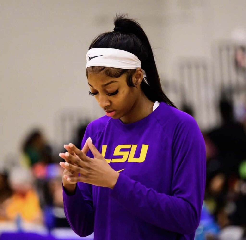 Angel Reese of LSU focused and determined preparing for game intense elite athlete wallpaper background